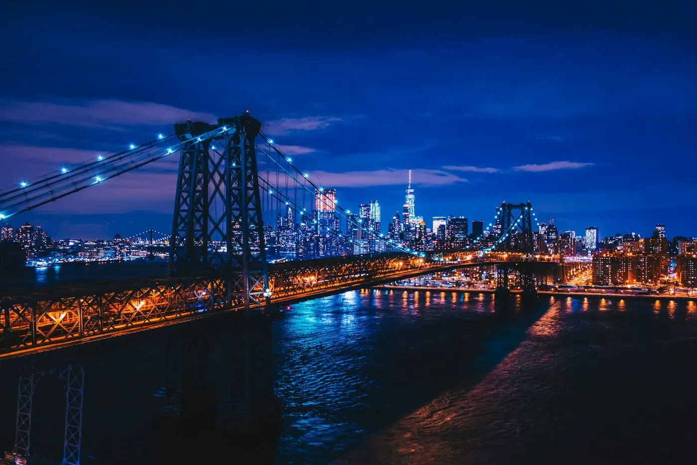 Illuminated suspension bridge at night