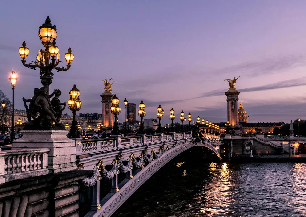 A river bridge illuminated at dusk