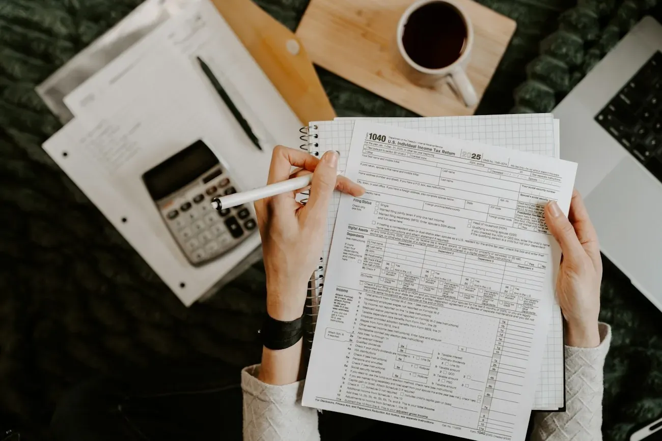 Hands reviewing documents at a desk